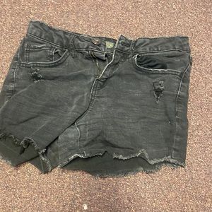 Faded black shorts, slightly distressed